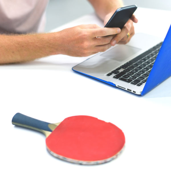 Man with smartphone and macbook