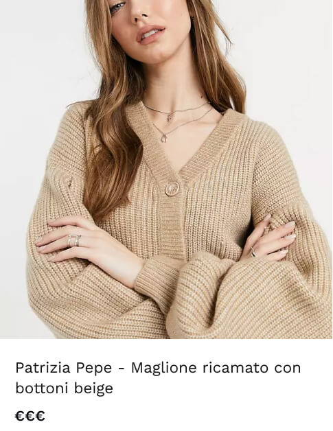 a woman wearing a tan sweater
