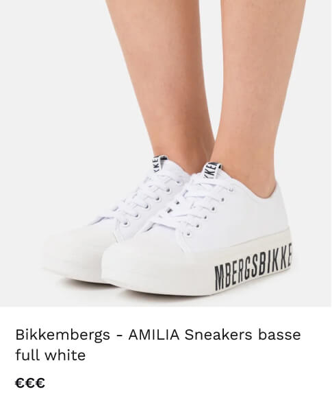a close-up of a woman's white shoes